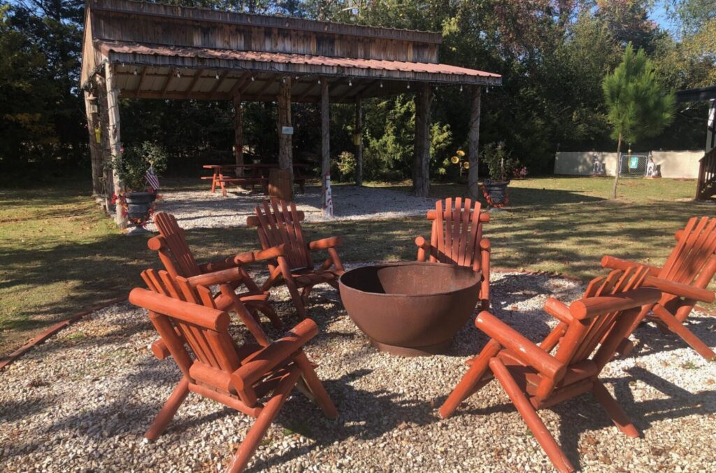 Cozy large firepit and pavillion at Wagon Train RV Park in Canton, Texas