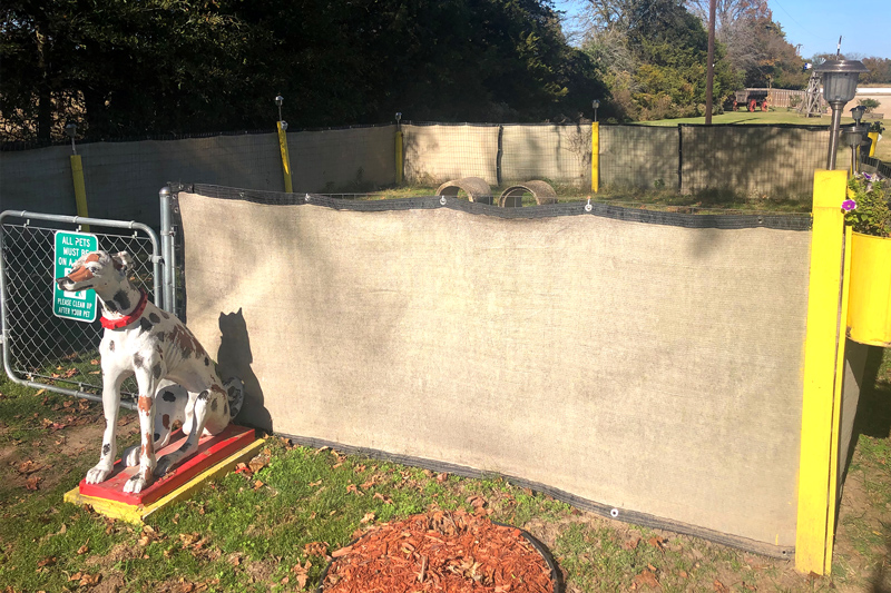 Open grassy dog park area at Wagon Train RV Park in Canton, Texas, with space for pets to play and exercise