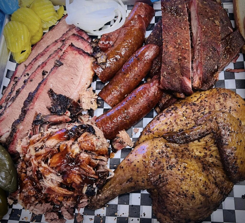 BBQ platter with brisket, sausage, ribs, and smoked chicken from Van Zandt BBQ near Canton, TX