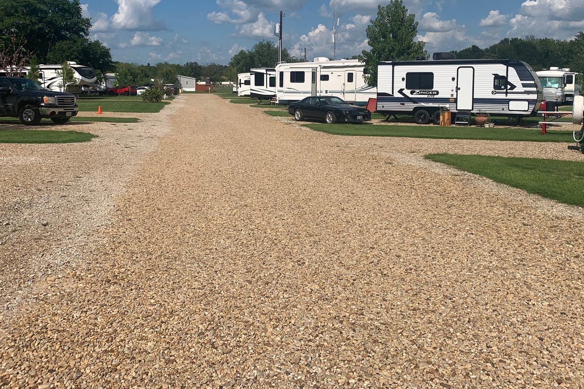 Wide gravel RV sites with easy pull-through access at Wagon Train RV Park in Canton, Texas